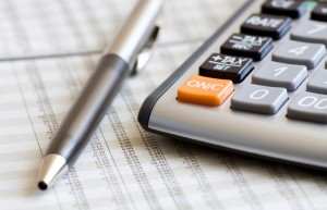 Balancing the Accounts. Calculator, pen