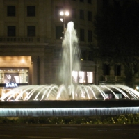 fountain lit up at night